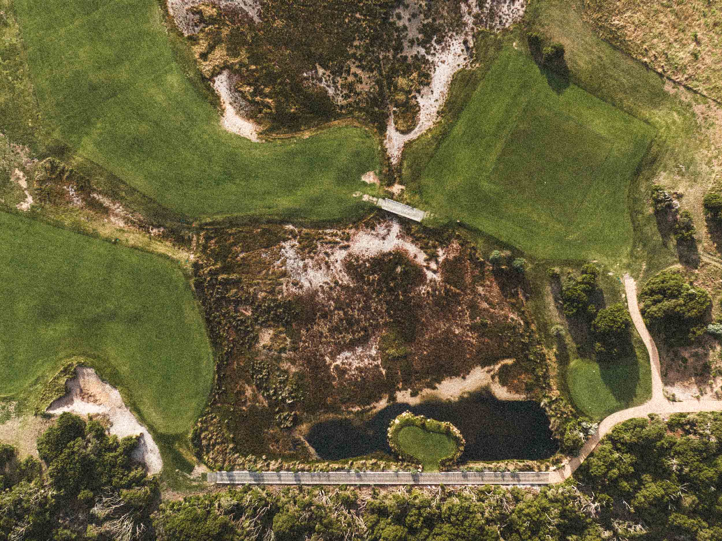 Golfer analyzing shot